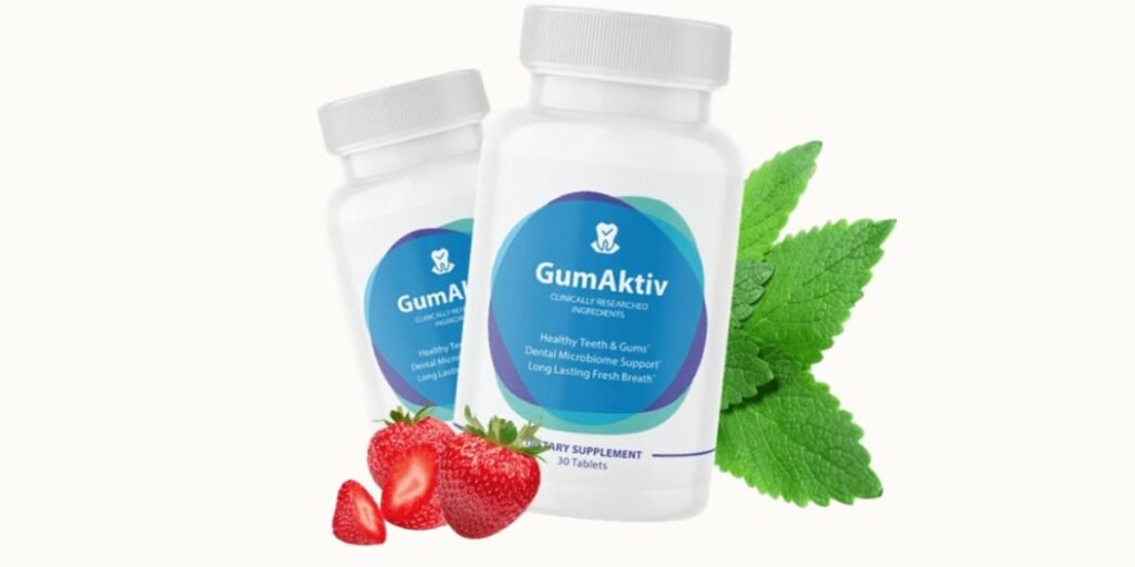 Here is a visually engaging photo featuring two white plastic supplement bottles of GumAktiv, standing against a clean white background. Fresh, vibrant strawberries and mint leaves are artfully arranged around the bottles, highlighting the product’s refreshing flavor and natural appeal.