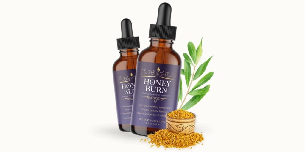 Two amber glass dropper bottles of HoneyBurn dietary supplement feature elegant purple and gold labels. They are displayed on a clean white background alongside a wooden bowl of golden bee pollen and a fresh green leaf, emphasizing its natural, metabolic-boosting ingredients.